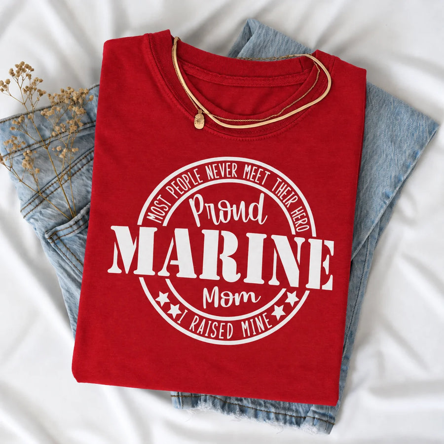 Proud Marine Mom I Raised Mine t-shirt in red, flat lay